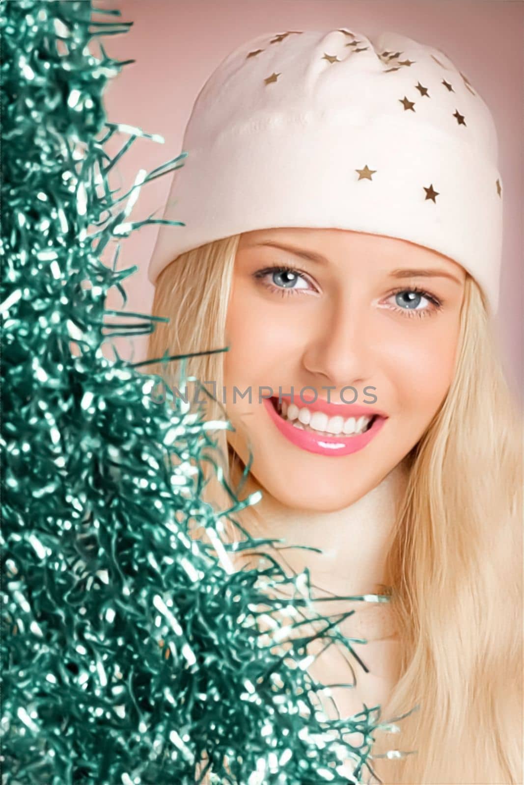 Woman wearing a white benny cap as beauty, and fashion. Merry Christmas and pleasant holidays. Beautiful blonde female smiling in a portrait while celebrating Christmas, New Year, and the winter holidays.