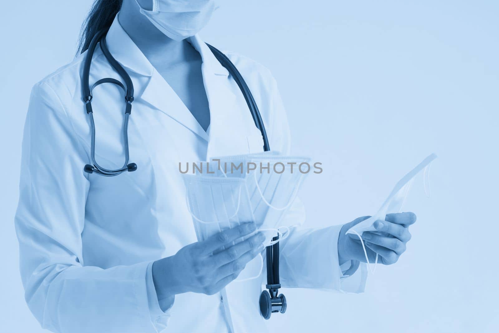Doctor or nurse recommend to use protective face mask to protect from virus infection, studio shoot with white background