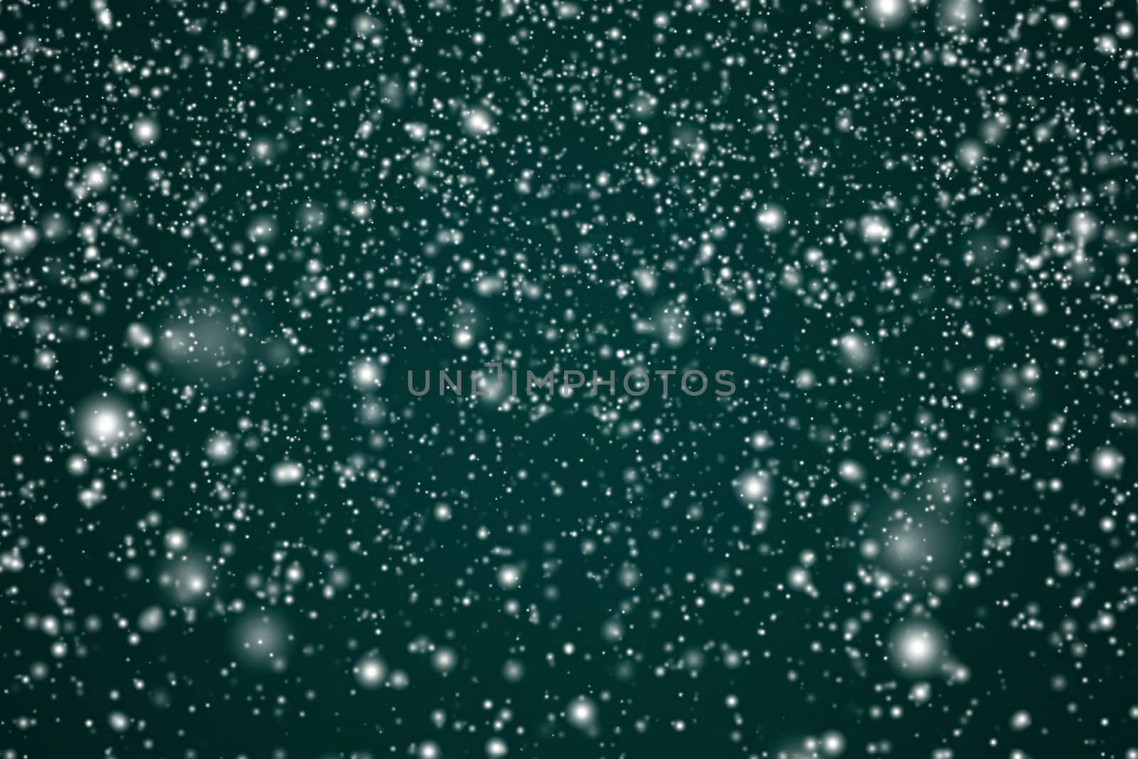 Winter holidays and wintertime background, white snow falling on festive green backdrop, snowflakes bokeh and snowfall particles as abstract snowing scene for Christmas and snowy holiday design by Anneleven