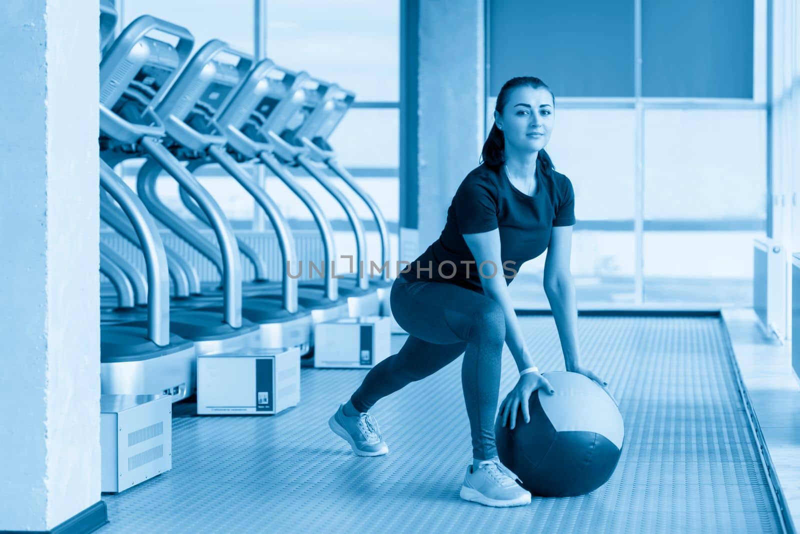Fitness concept. Doing sport workout in the gym