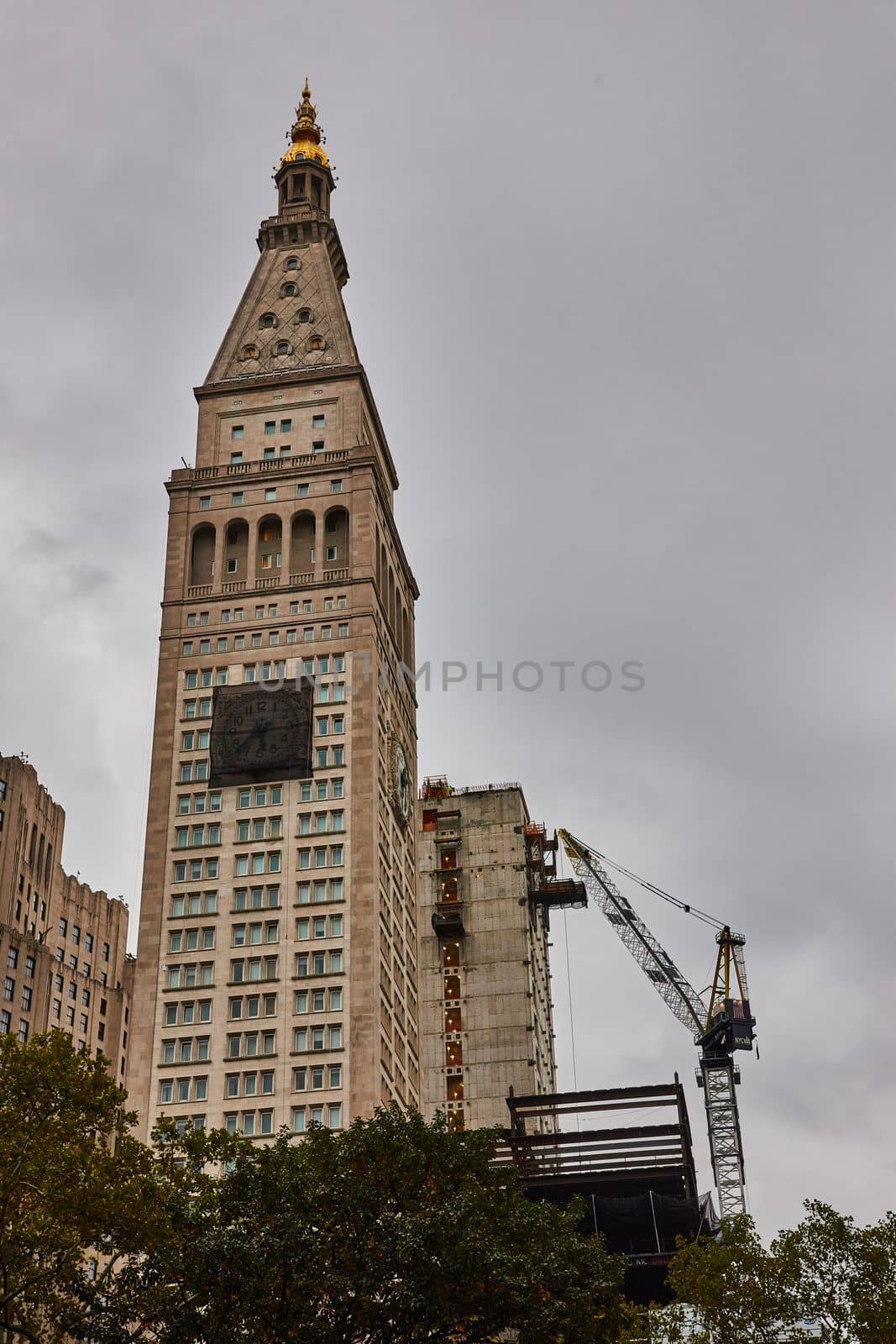 New York City building with front clock covered for construction by njproductions
