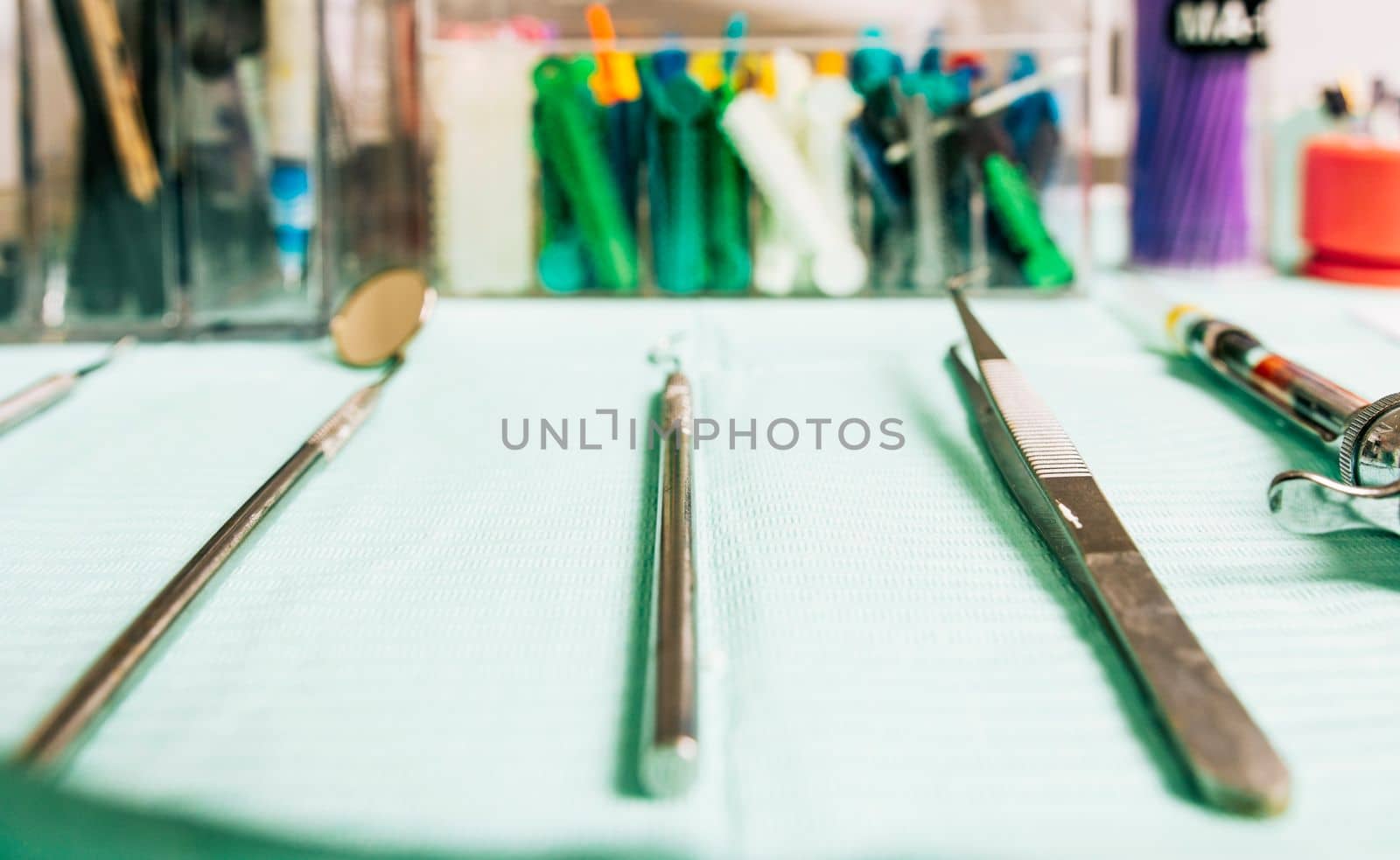 Stomatologist tools close-up on table. Set of dental tools on dentist's panel. Close up of dental tools on dentist's table, Dentist tools on the table by isaiphoto