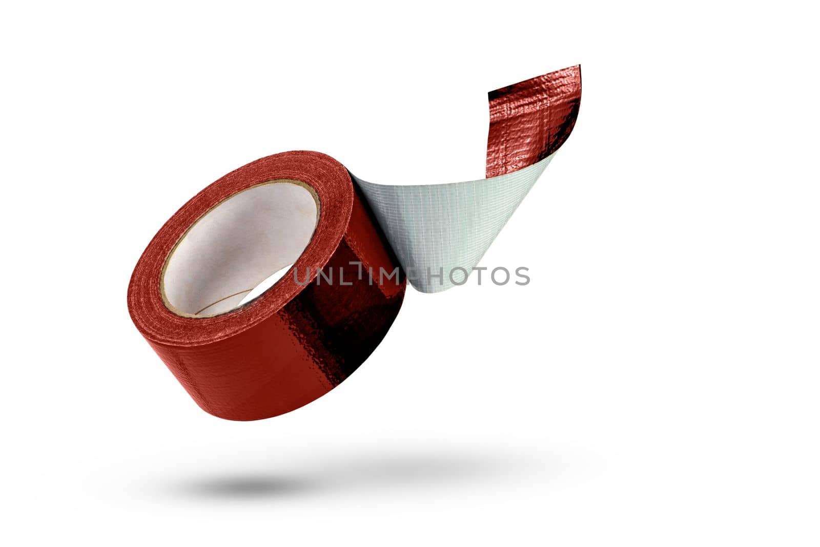 Roll of red adhesive tape isolated on white background. Reinforced red duct tape falls, casting a shadow. Unwound roll of electrical tape