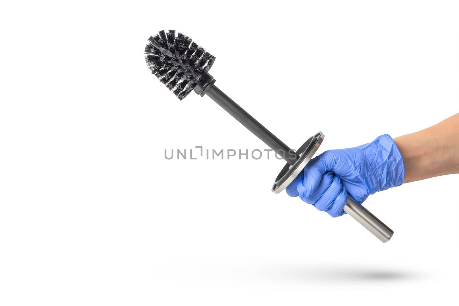 Toilet brush in hand on a white isolated background, a hand in a blue rubber glove holds a black chrome toilet brush