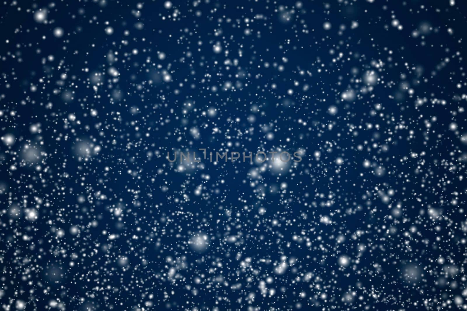 Winter holidays and wintertime background, white snow falling on dark blue backdrop, snowflakes bokeh and snowfall particles as abstract snowing scene for Christmas and snowy holiday design, copyspace