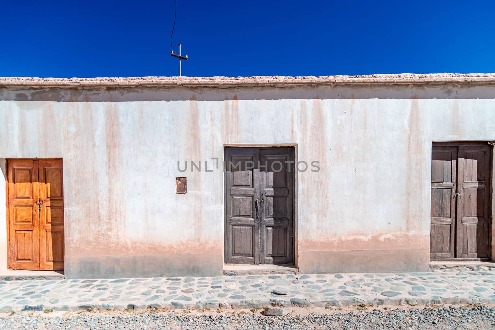 a house made of clay and red bricks in the countryside of Aregenina in the Andes mountains. 