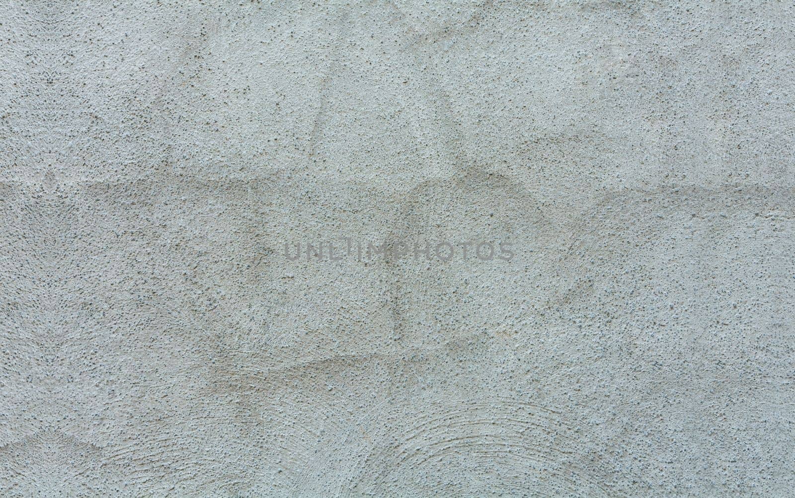 Texture of a gray wall. Cracked gray wall background. Details of a textured gray wall, Granite textured gray wall background. Gray wall of house with texture