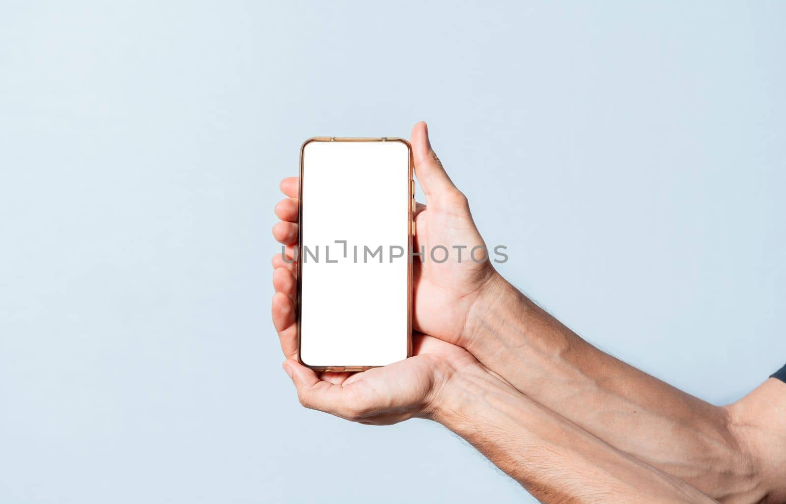 Hands presenting an advertisement on the cell phone. Hands showing cell phone screen isolated. Hands showing cell phone white screen. Hands together showing the screen of a cell phone