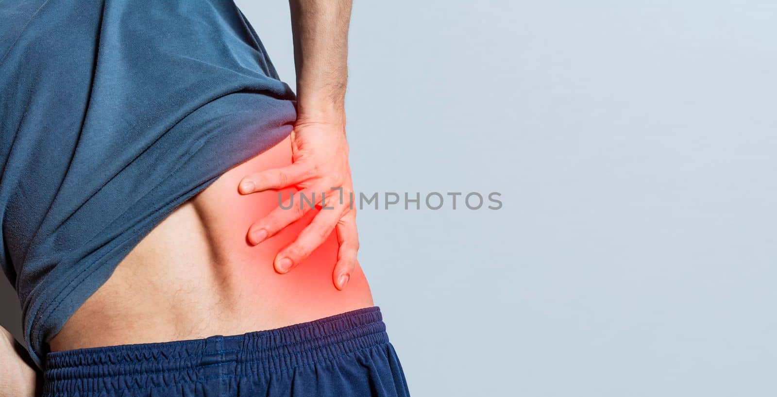 Man with spine and lower back problems, people with lower back pain isolated, lumbar problems concept, a sore man with back pain. Unrecognizable people with lower back pain