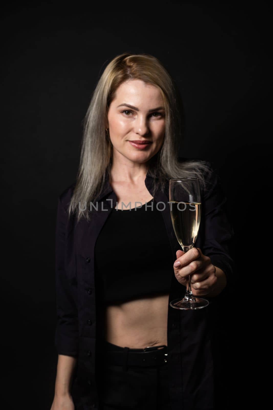woman with a glass on a black background by Andelov13