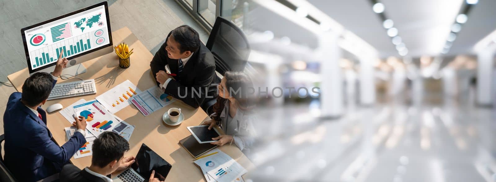 Smart businessman and businesswoman talking discussion in widen group meeting at office table in a modern office interior. Business collaboration strategic planning and brainstorming of coworkers.