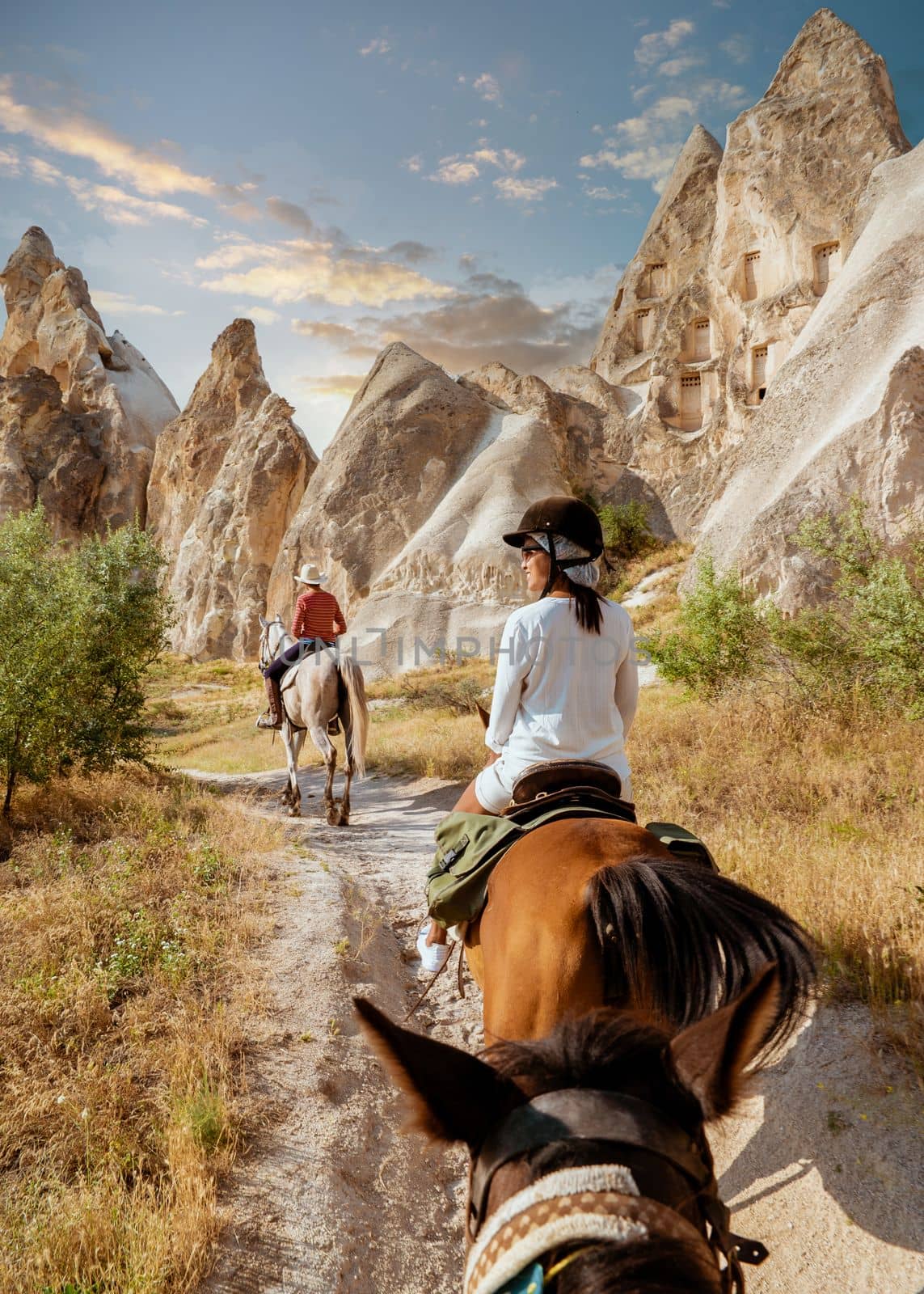 young woman on a horse back during vacation in Turkey Kapadokya watching Cappadocia by fokkebok