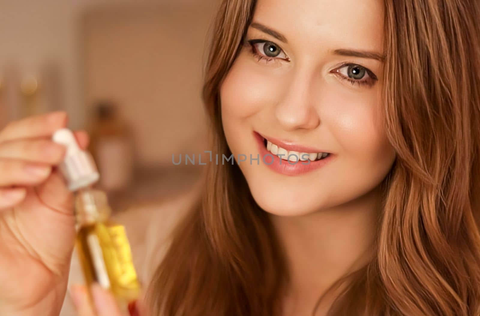 Beautiful woman holding organic oil serum bottle and smiling, evening beauty and skincare routine.