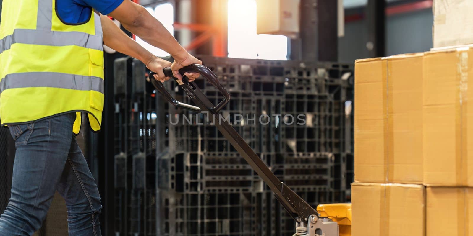 Working at warehouse. Male warehouse worker checking in storage department. Employee organizing goods distribution to the market