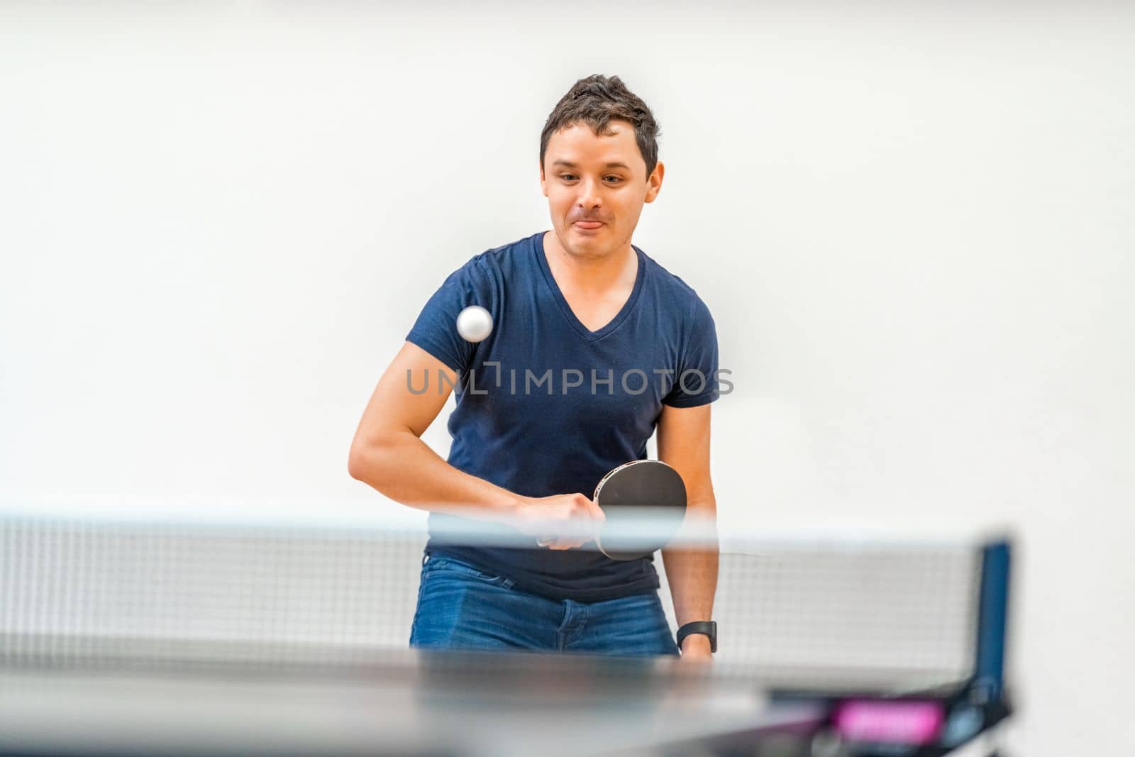 man plays table tennis. copy space. 