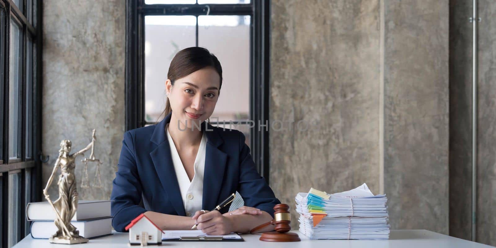 Business woman or lawyers working on wooden desk in office. Law, legal services, advice,Judge auction and real estate concept. by wichayada