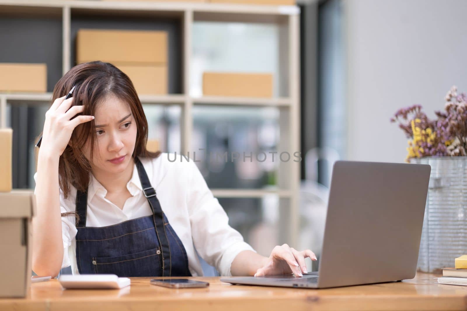 Young Asian business entrepreneur stress in online business, failure woman with working problem. SME entrepreneur and Online selling concept...