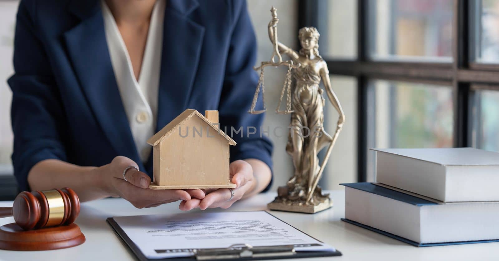 Real estate concept, businesswoman holding a house icon. House on Hand.Property insurance and security concept. Protecting gesture of female and symbol of house