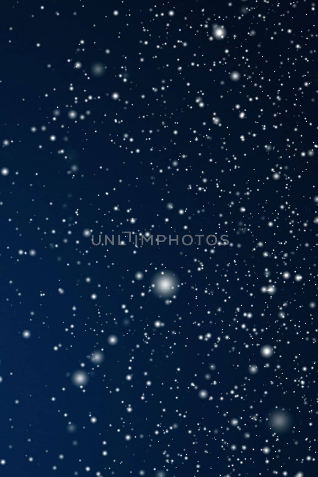 Winter holidays and wintertime background, white snow falling on dark blue backdrop, snowflakes bokeh and snowfall particles as abstract snowing scene for Christmas and snowy holiday design, copyspace