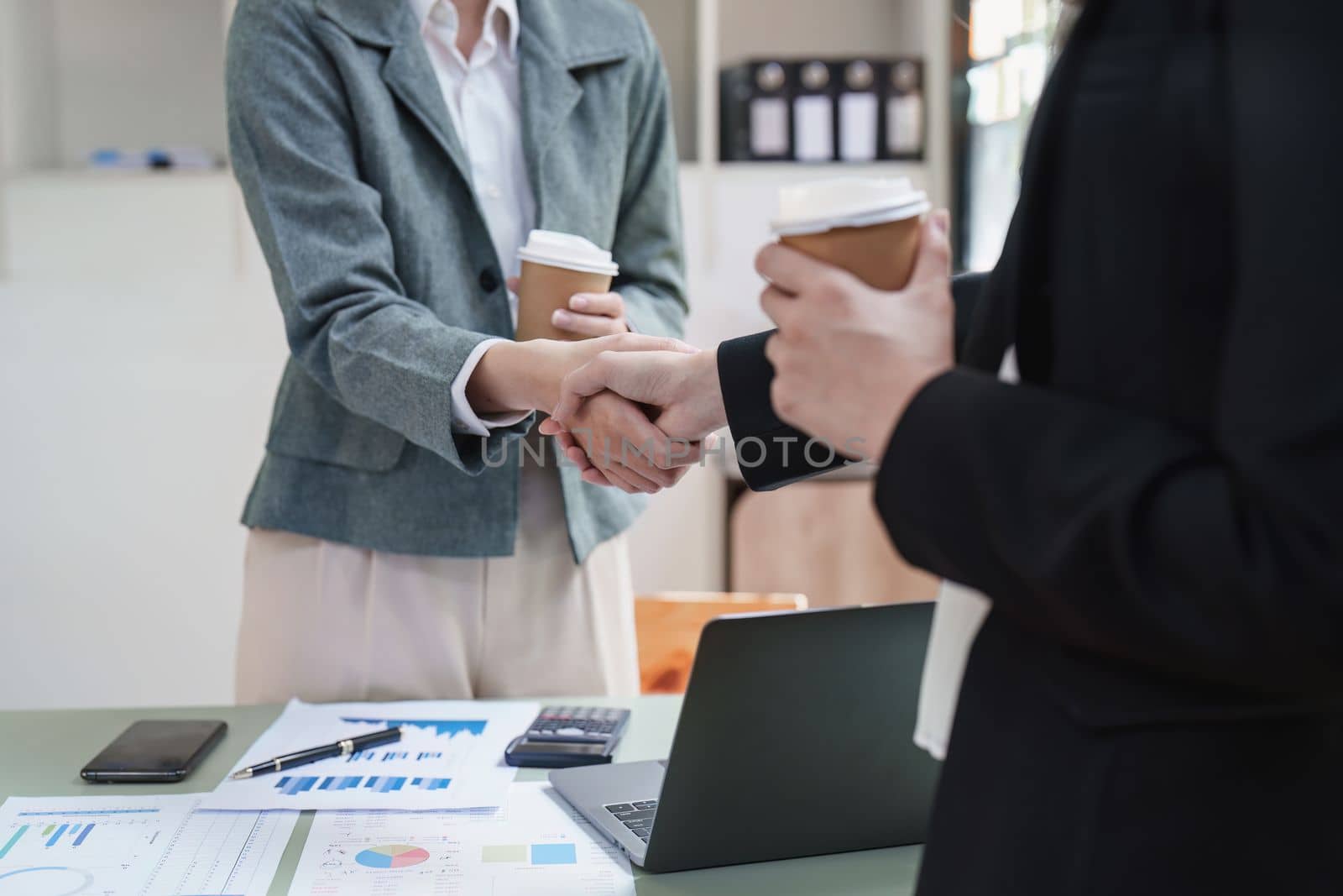 Business people handshake with business partners. Successful business concept. shaking hand after deal concept by itchaznong