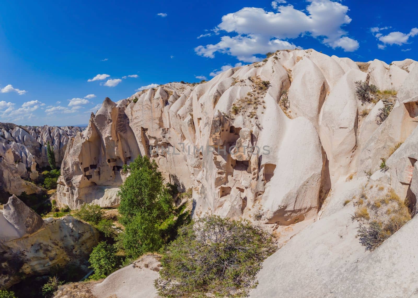 Beautiful stunning view of the mountains of Cappadocia and cave houses. Turkey by galitskaya