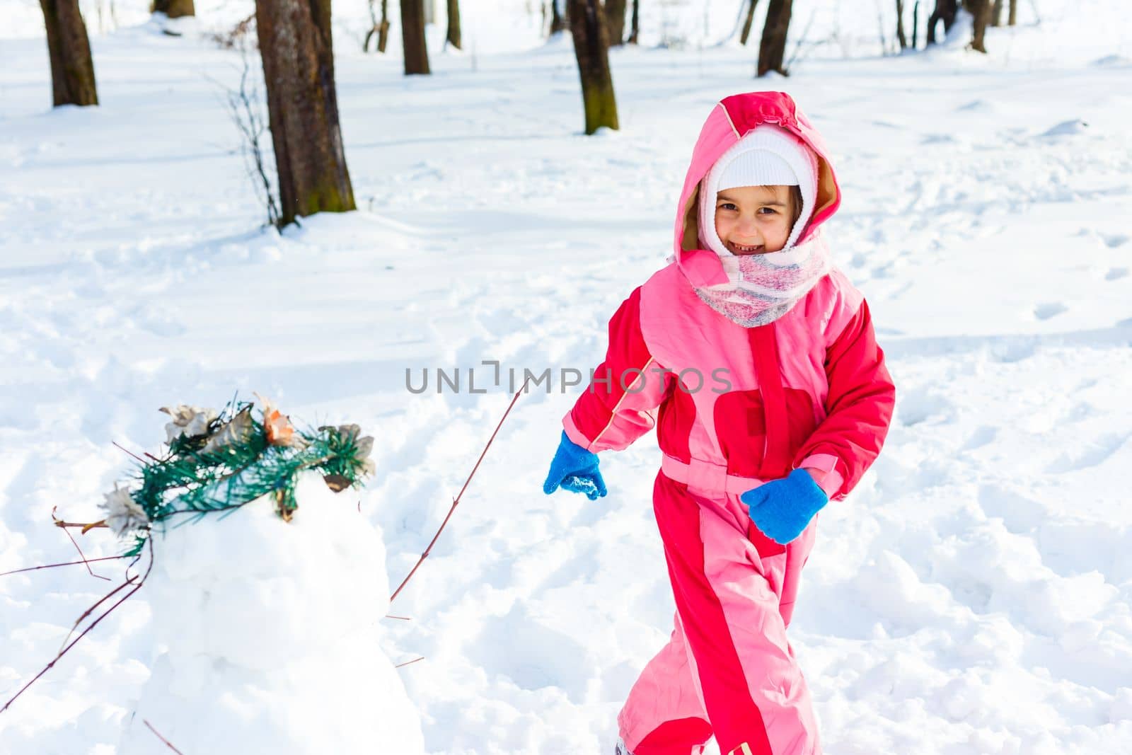 little girl outdoors in winter day.