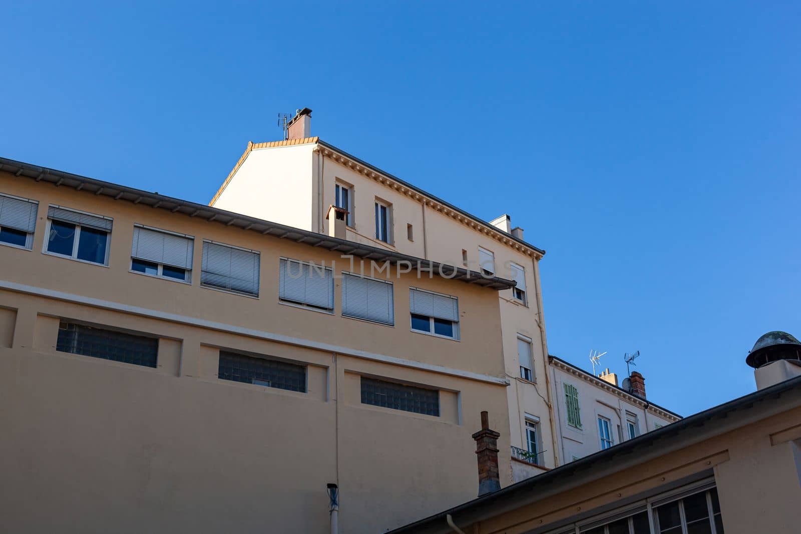 industrial building in a south european country, blue sky background