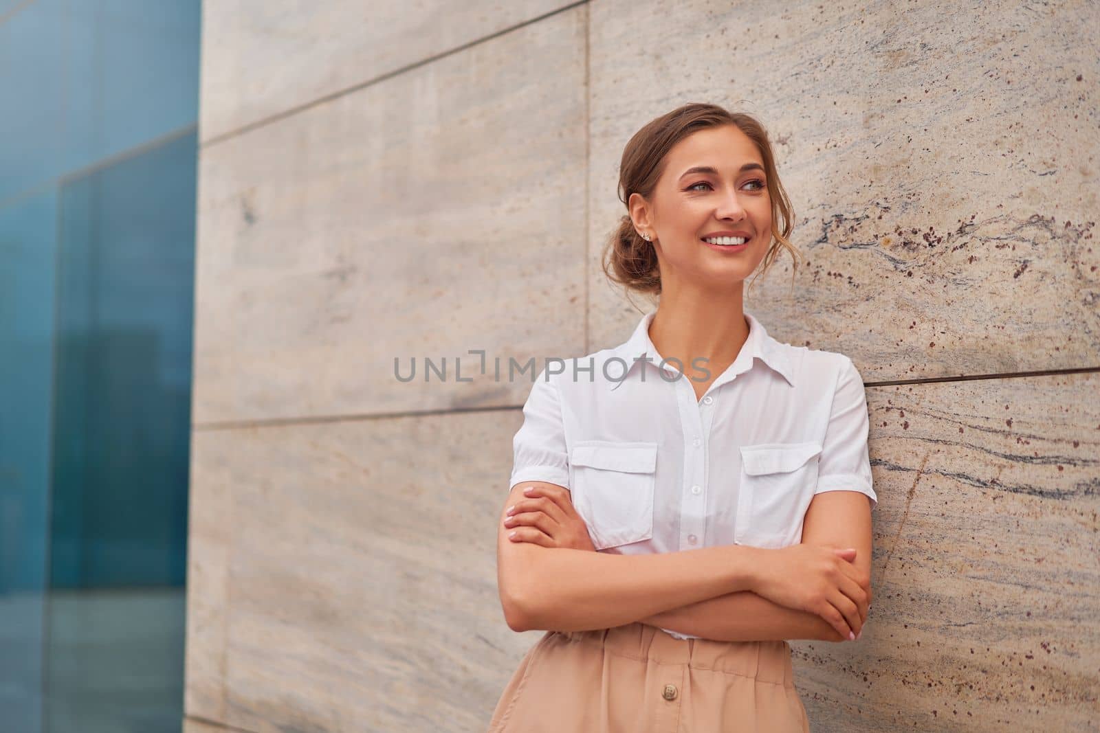 Businesswoman successful woman business person standing arms crossed outdoor corporate building exterior Smile happy caucasian confidence professional business woman middle age female entrepreneur