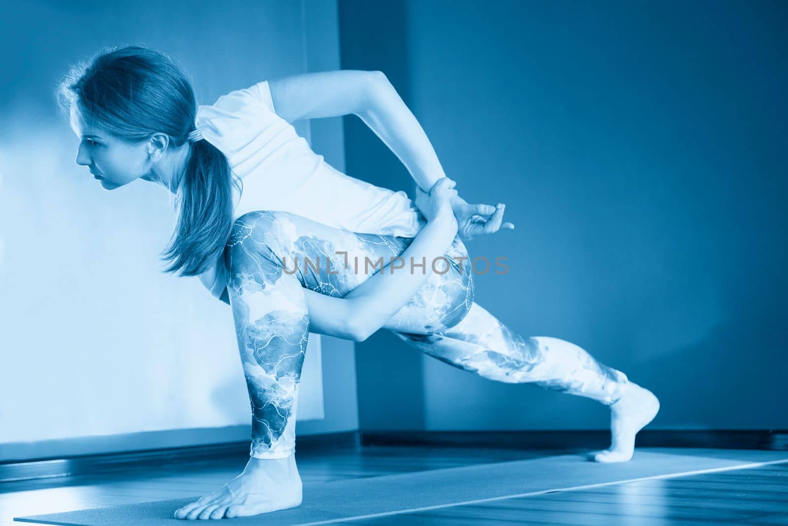 woman stretching on mat in gym, fitness, sport, training and lifestyle concept by Mariakray