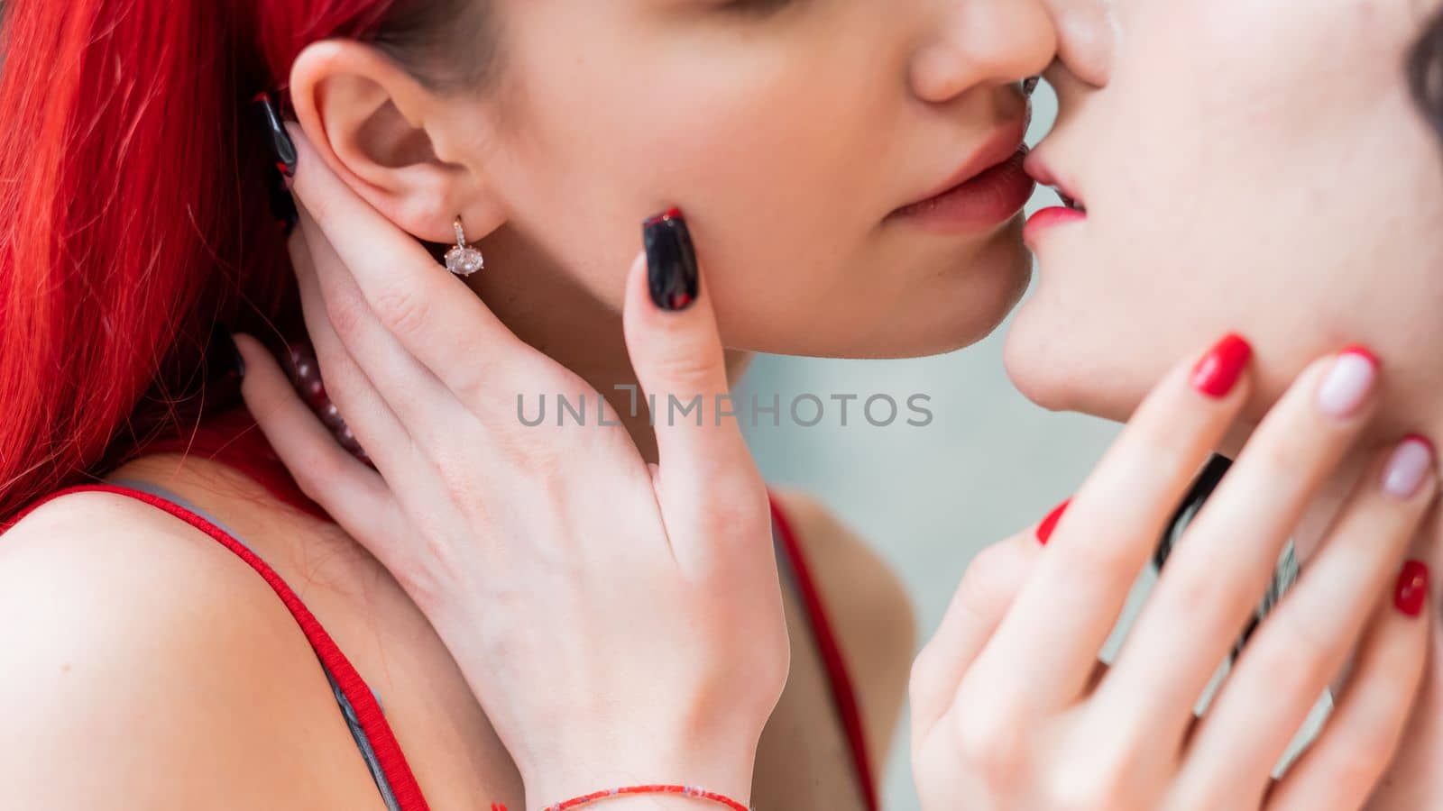 Close-up portrait of kissing Caucasian women. same sex love