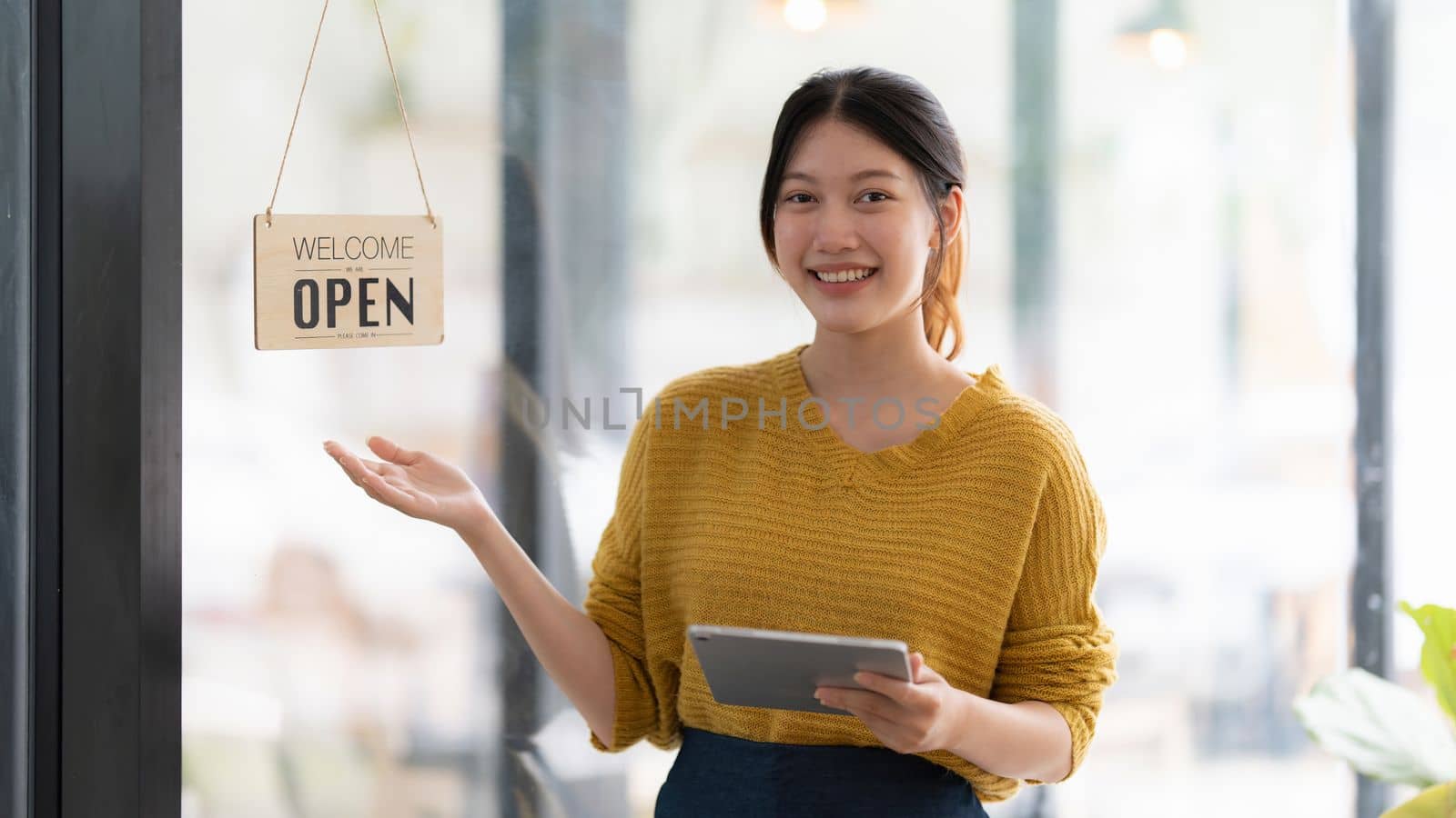 Portrait of Startup successful small business owner in coffee shop. SME entrepreneur seller business concept.