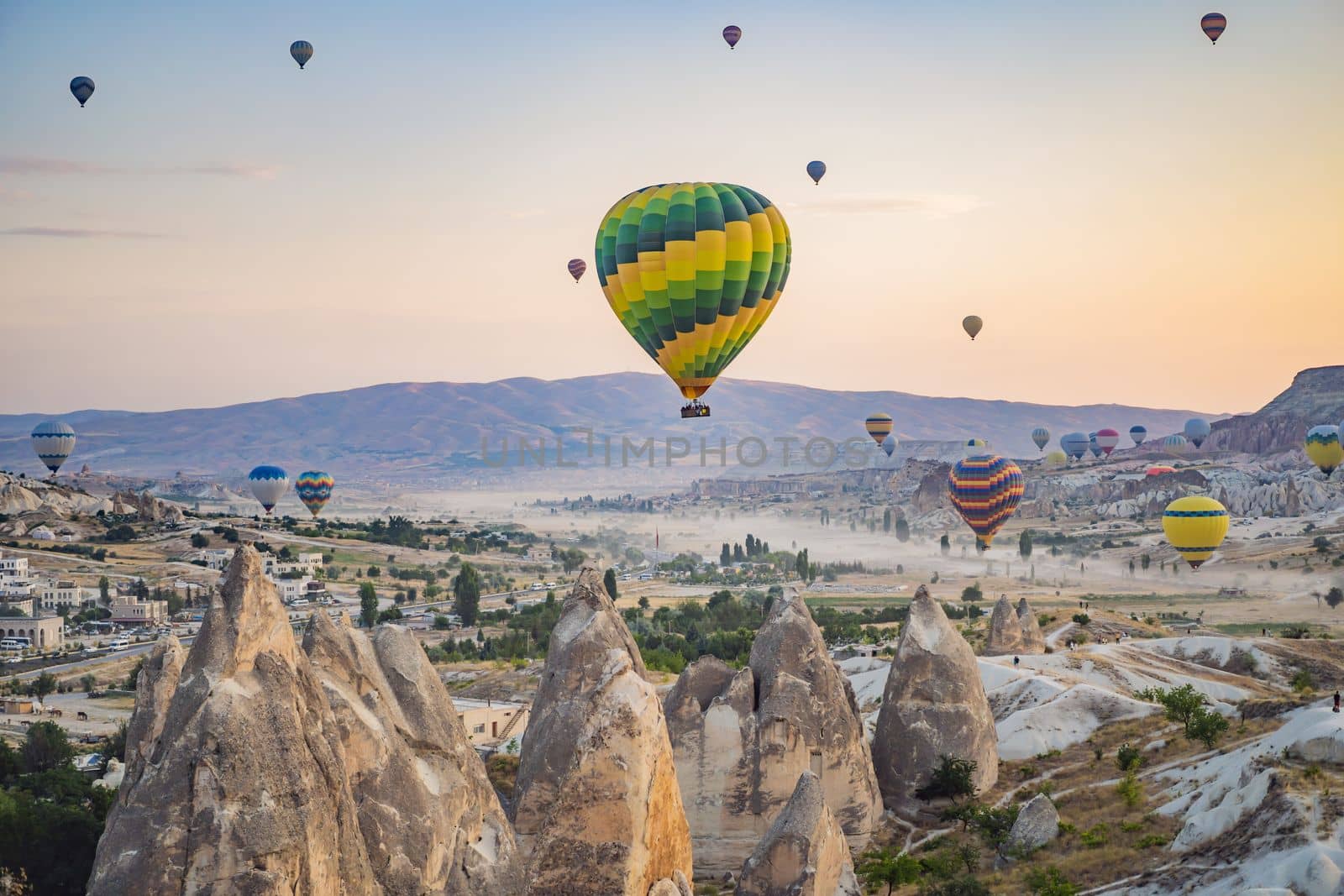 Colorful hot air balloon flying over Cappadocia, Turkey.