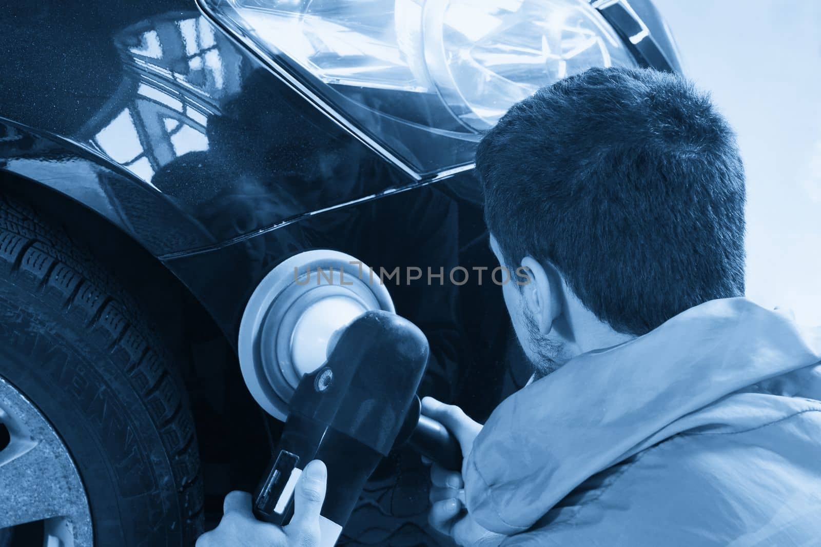 hands holding the work tool polish car, Auto Mechanic Polishing Car concept