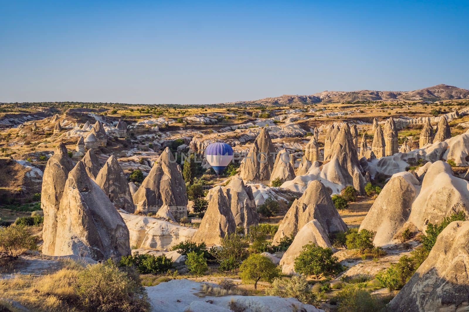 Colorful hot air balloon flying over Cappadocia, Turkey.