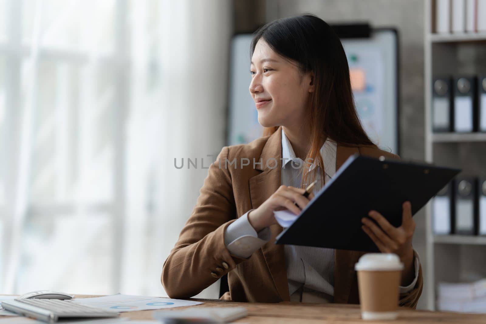 Beautiful asian businesswoman working in office. business finance concept.