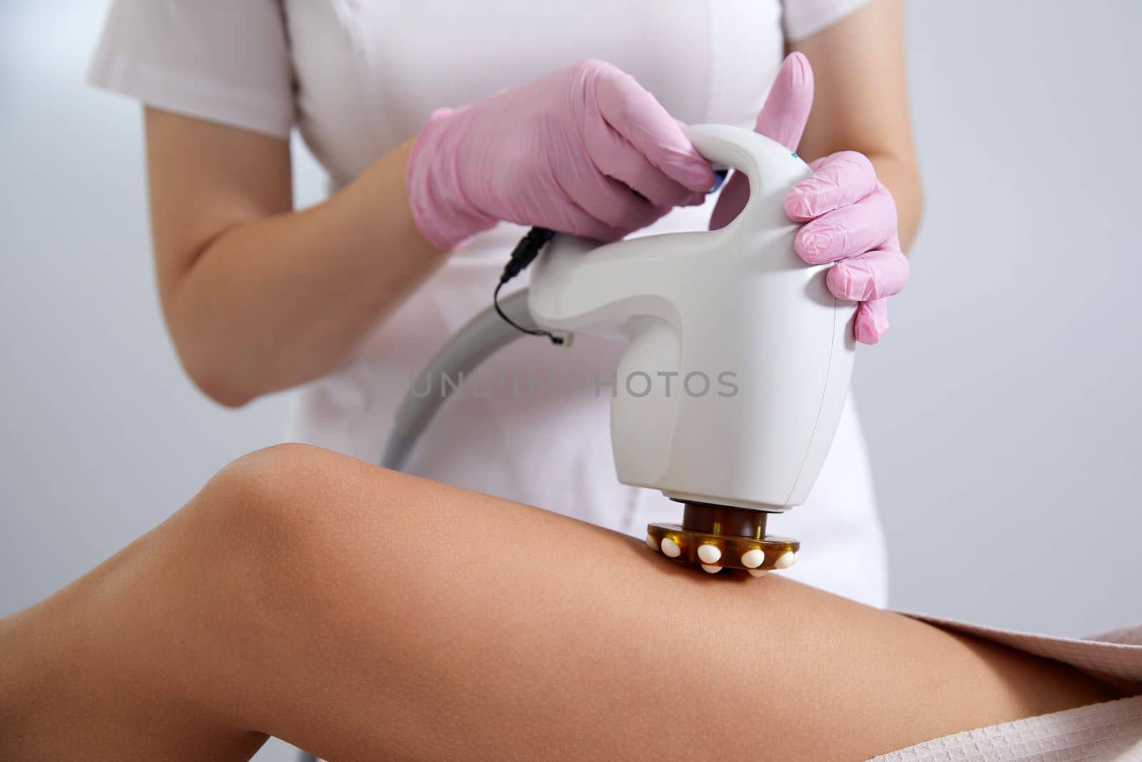 Woman is having Laser Treatment On Thigh. Ultrasound cavitation body contouring treatment. Anti cellulite treatment