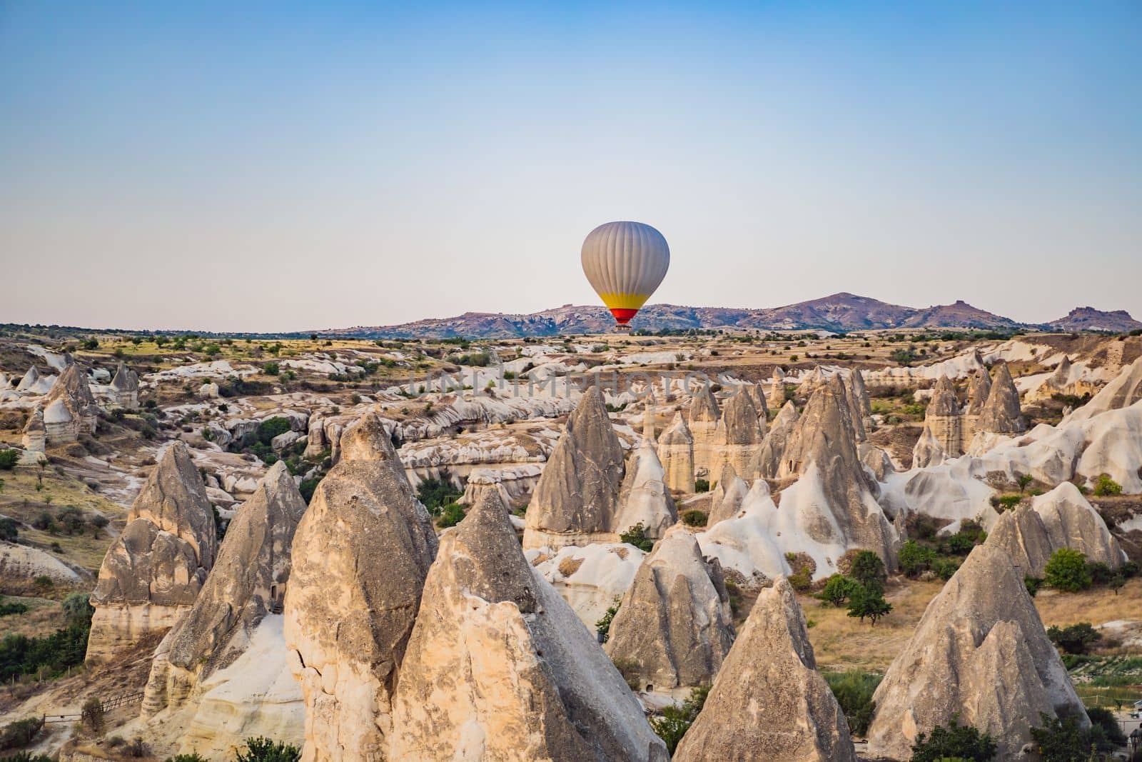 Colorful hot air balloon flying over Cappadocia, Turkey.