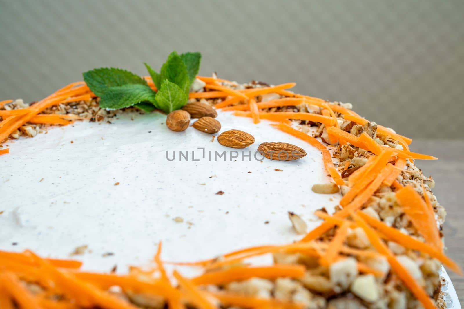 carrot cake with nuts and cream.