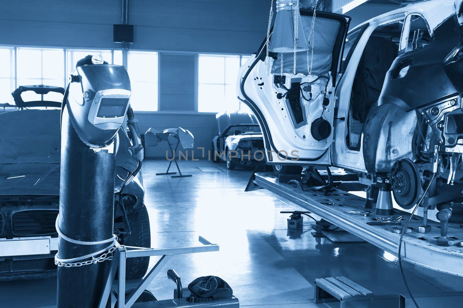 Welding equipment in a car repair station, no people