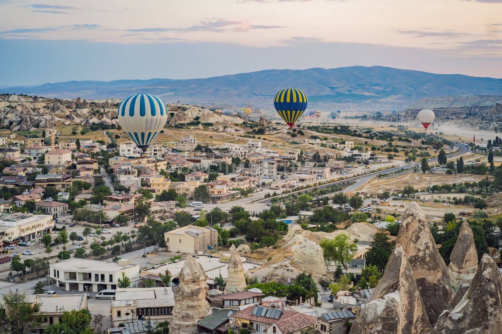 Colorful hot air balloon flying over Cappadocia, Turkey by galitskaya