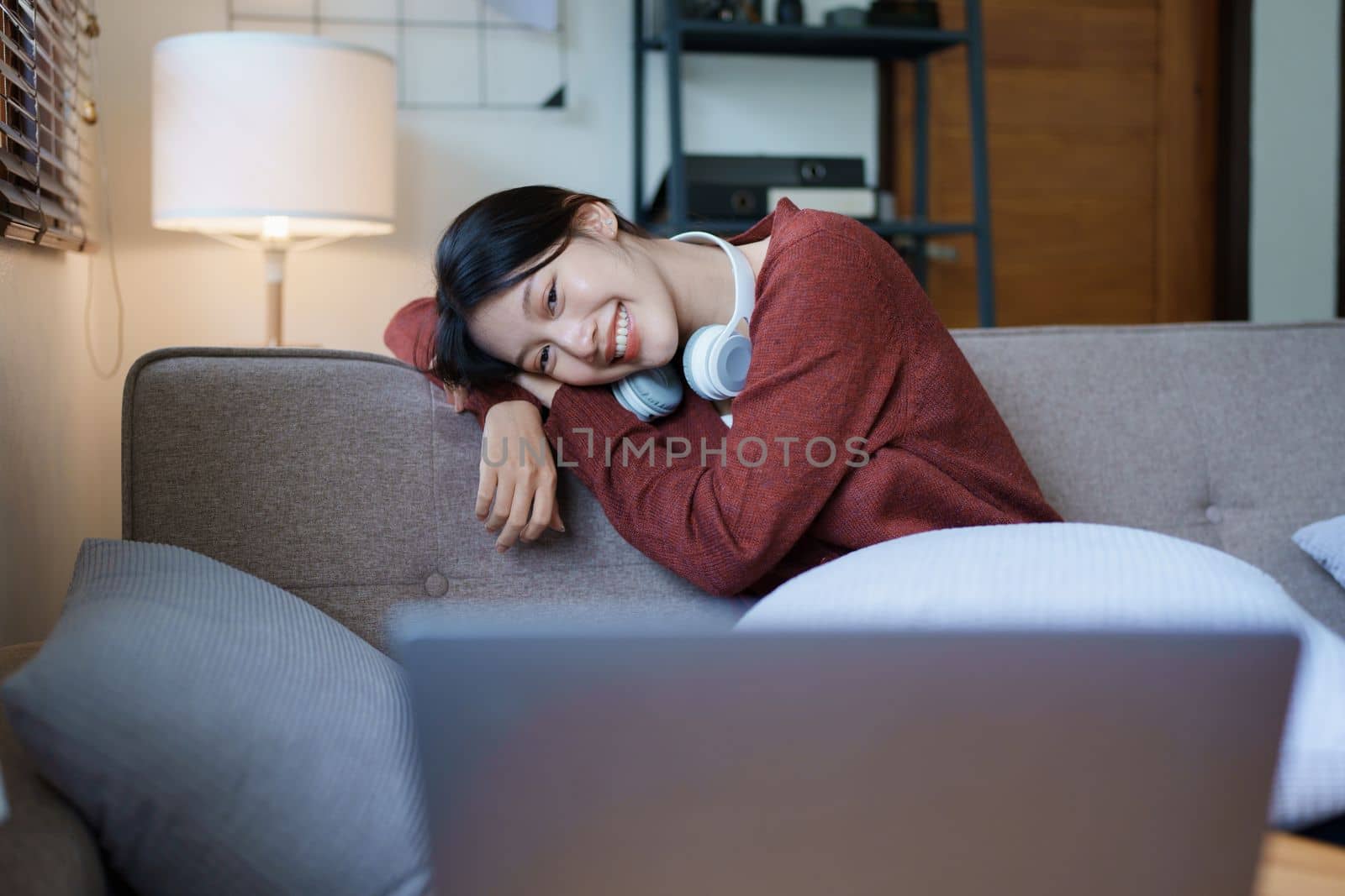 Portrait of a beautiful Asian teenage girl using a computer by Manastrong