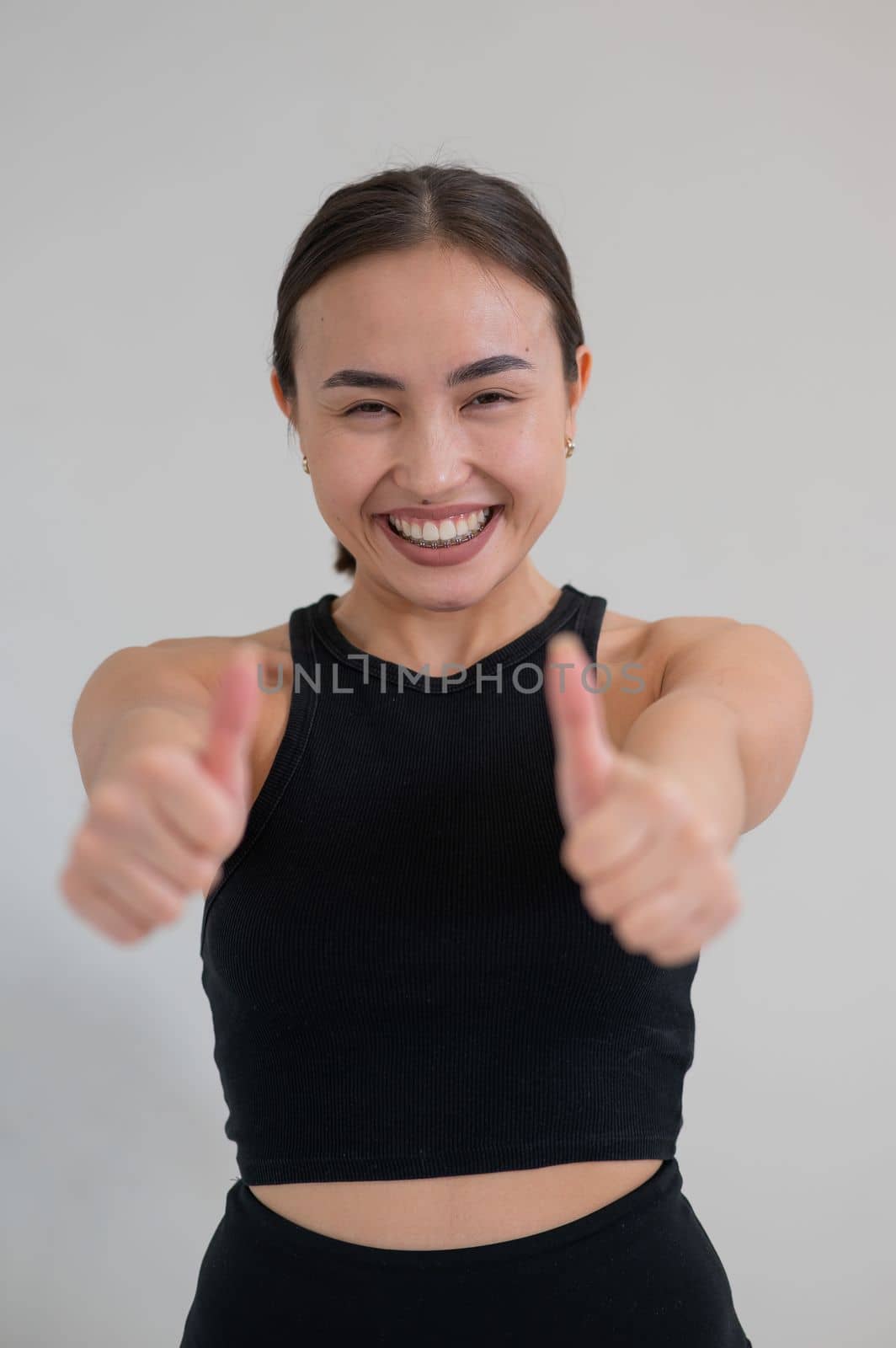 Portrait of beautiful asian woman showing thumb up