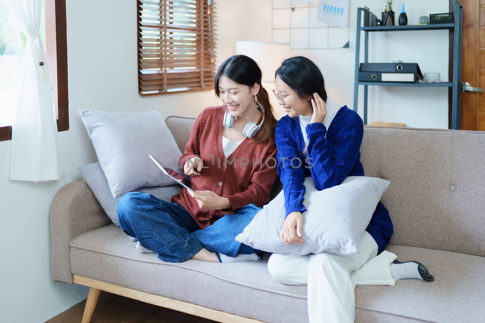 lgbtq, lgbt concept, homosexuality, portrait of two asian women enjoying together and showing love for each other while using tablet.