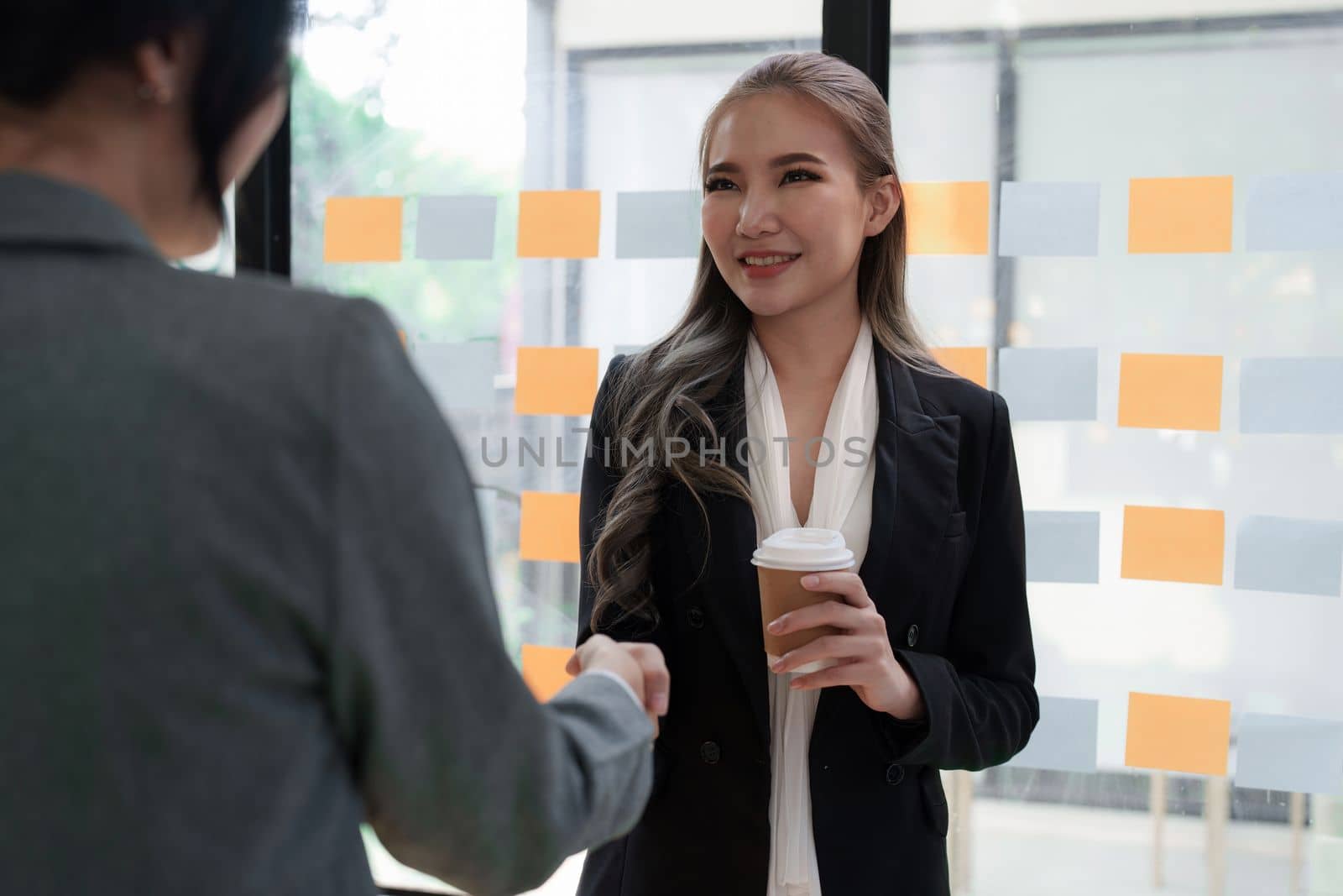 Business partnership meeting concept. Image businessmans handshake. Successful businessmen handshaking after good deal. Group support concept.