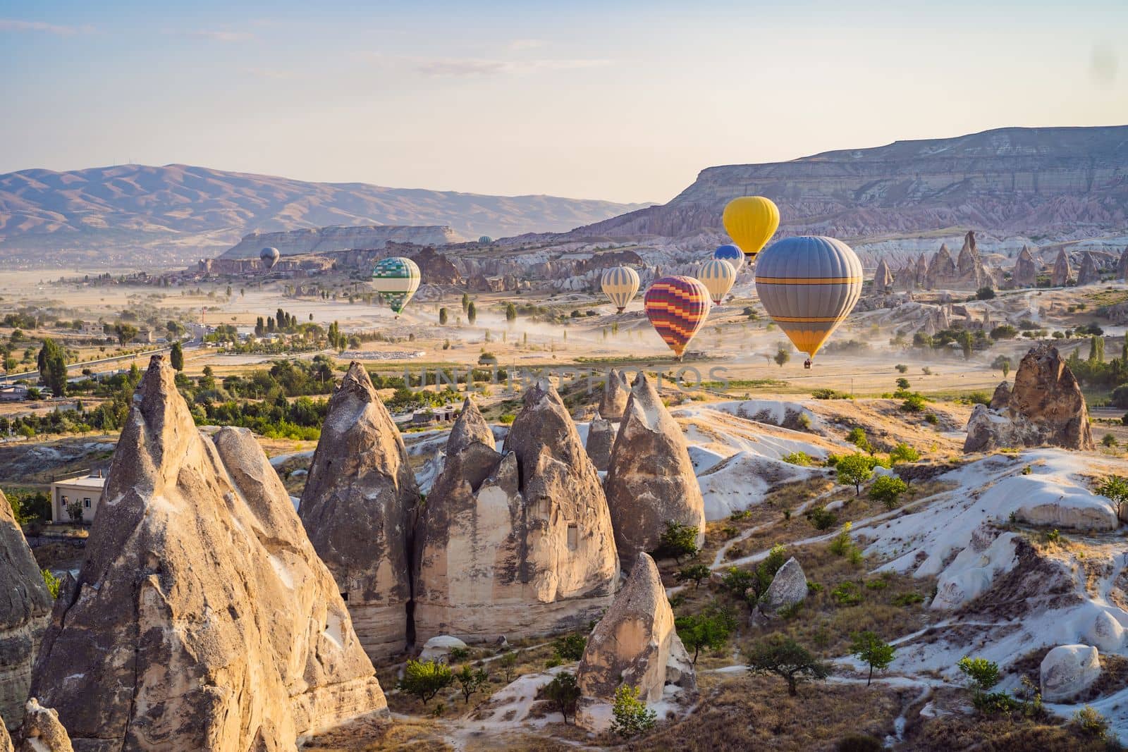 Colorful hot air balloon flying over Cappadocia, Turkey.