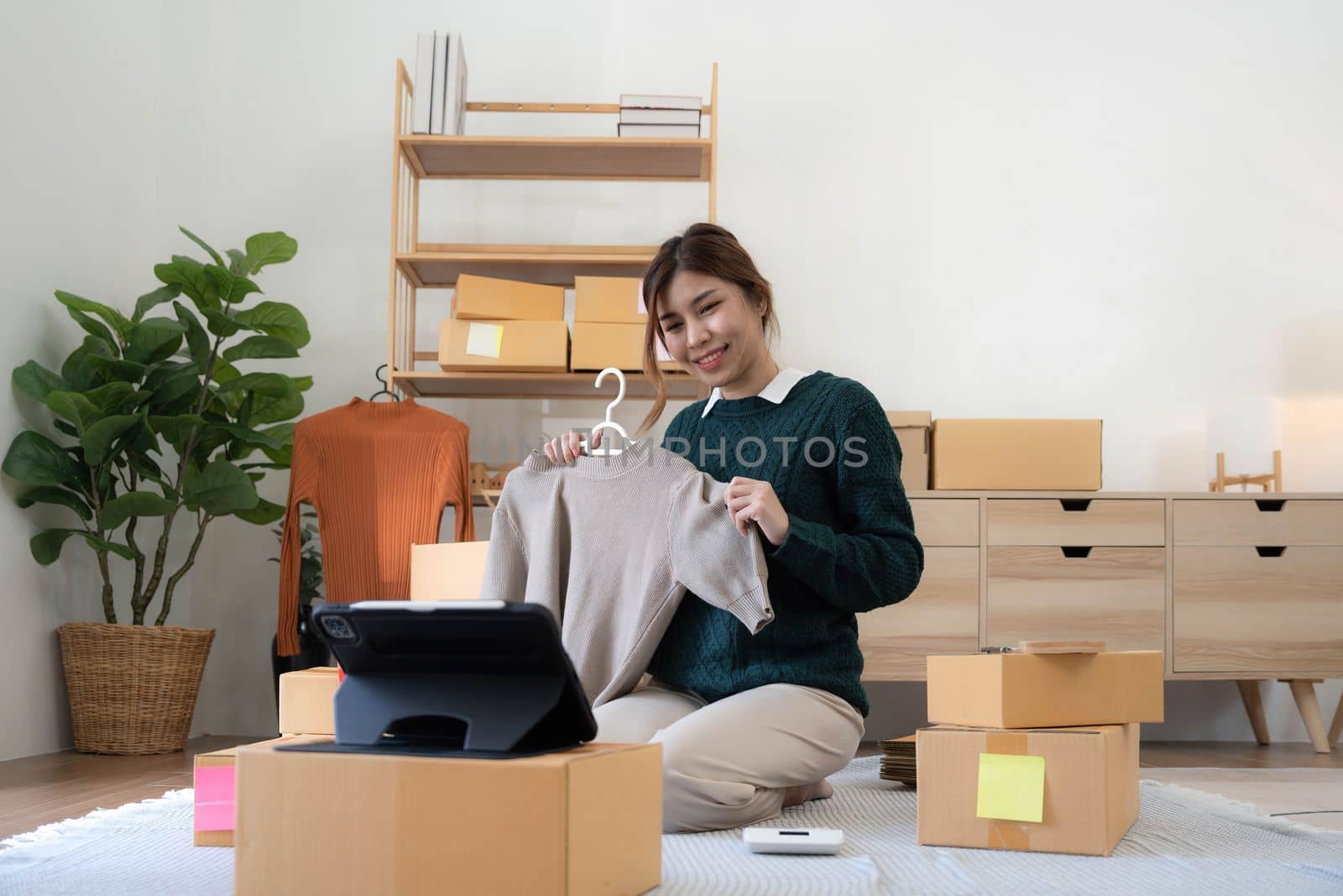 Online seller owner. Online shopping. Business Start up SME concept. Young startup entrepreneur small business owner working at home