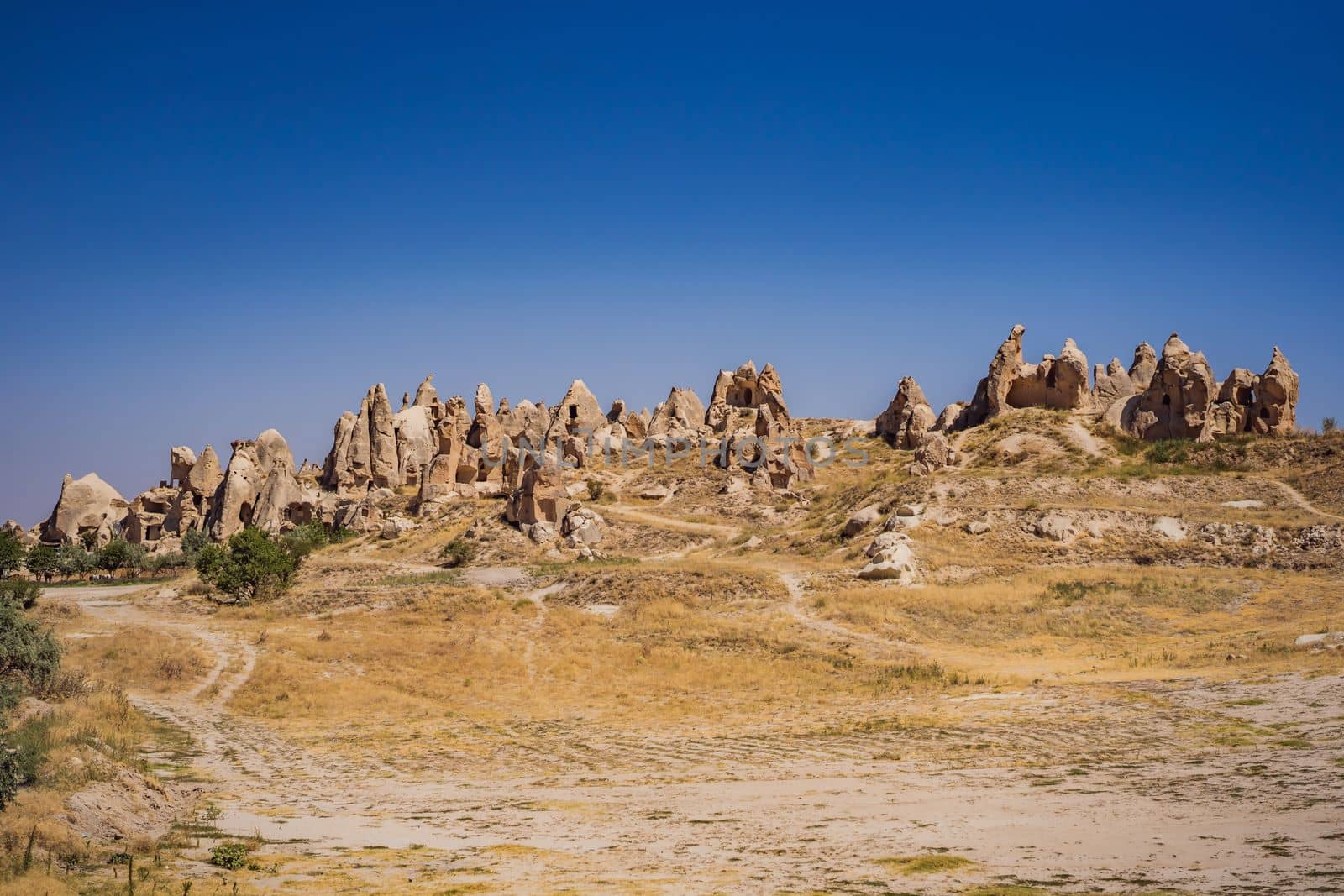 Beautiful stunning view of the mountains of Cappadocia and cave houses. Turkey by galitskaya