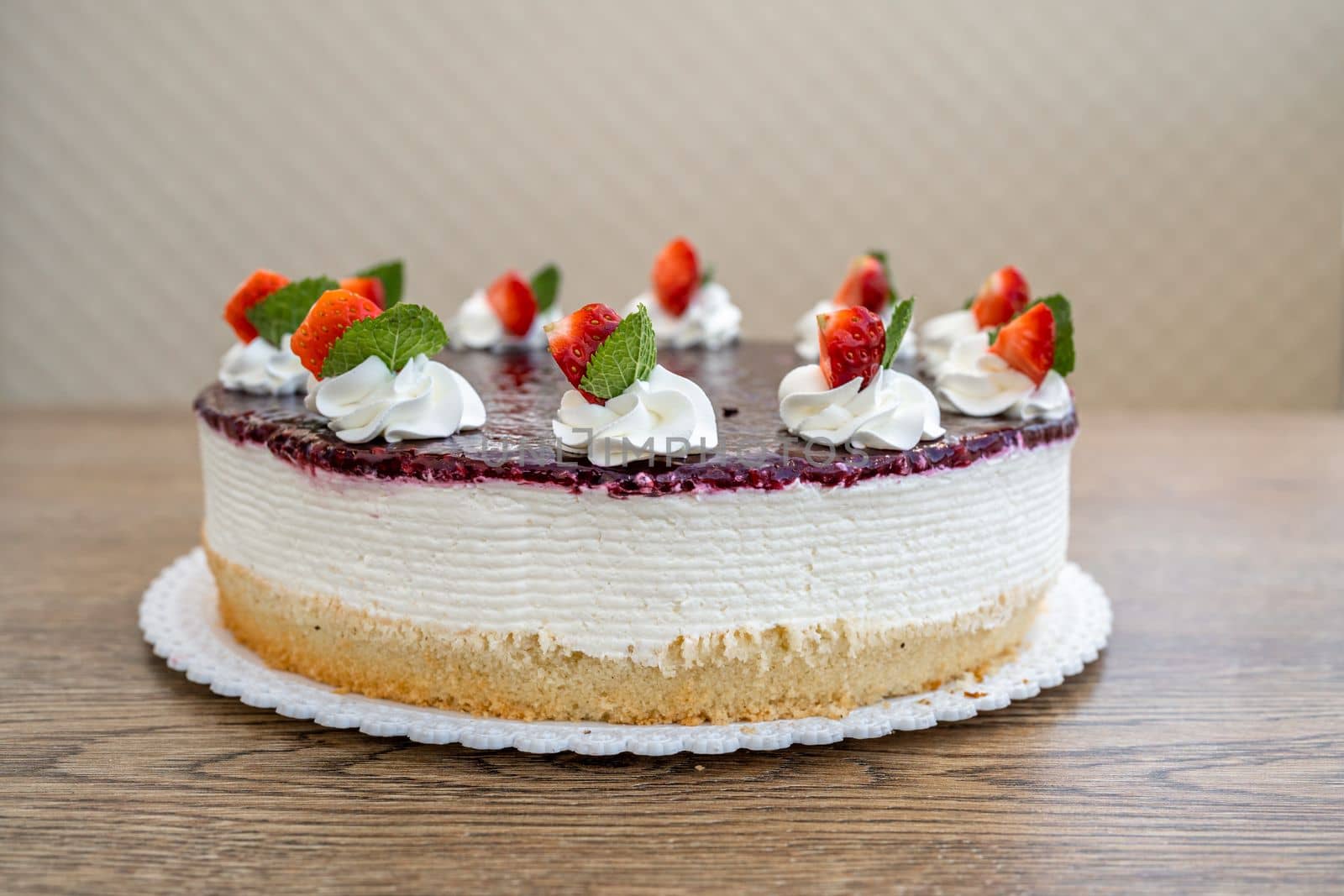 fruit cake with marmalade and whipped cream.