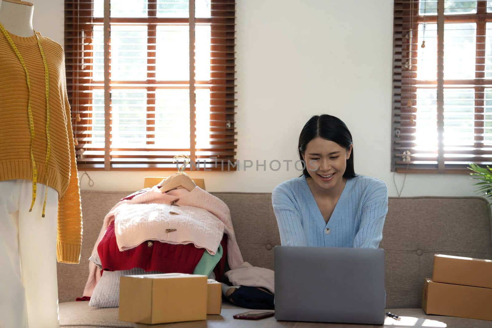 Startup small business entrepreneur SME, asian woman packing box. Portrait of young Asian small business owner in home office, online sell marketing delivery