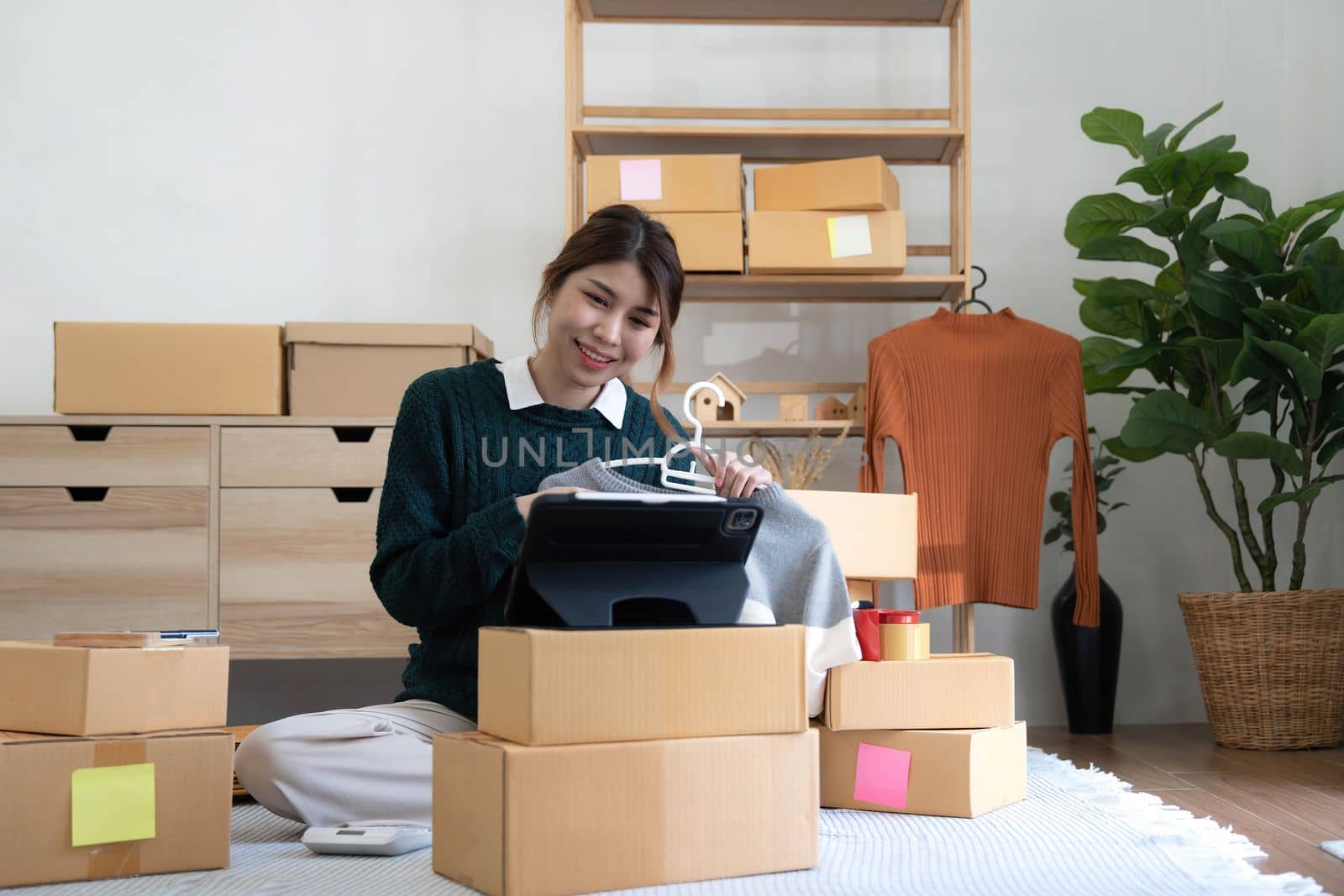 Online seller owner. Online shopping. Business Start up SME concept. Young startup entrepreneur small business owner working at home
